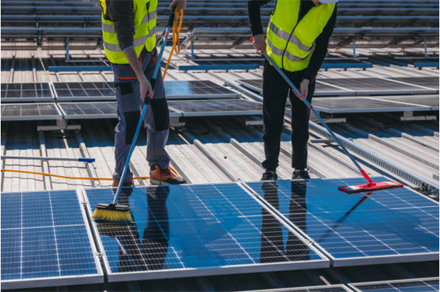 Solar maintenance technician performing AMC service